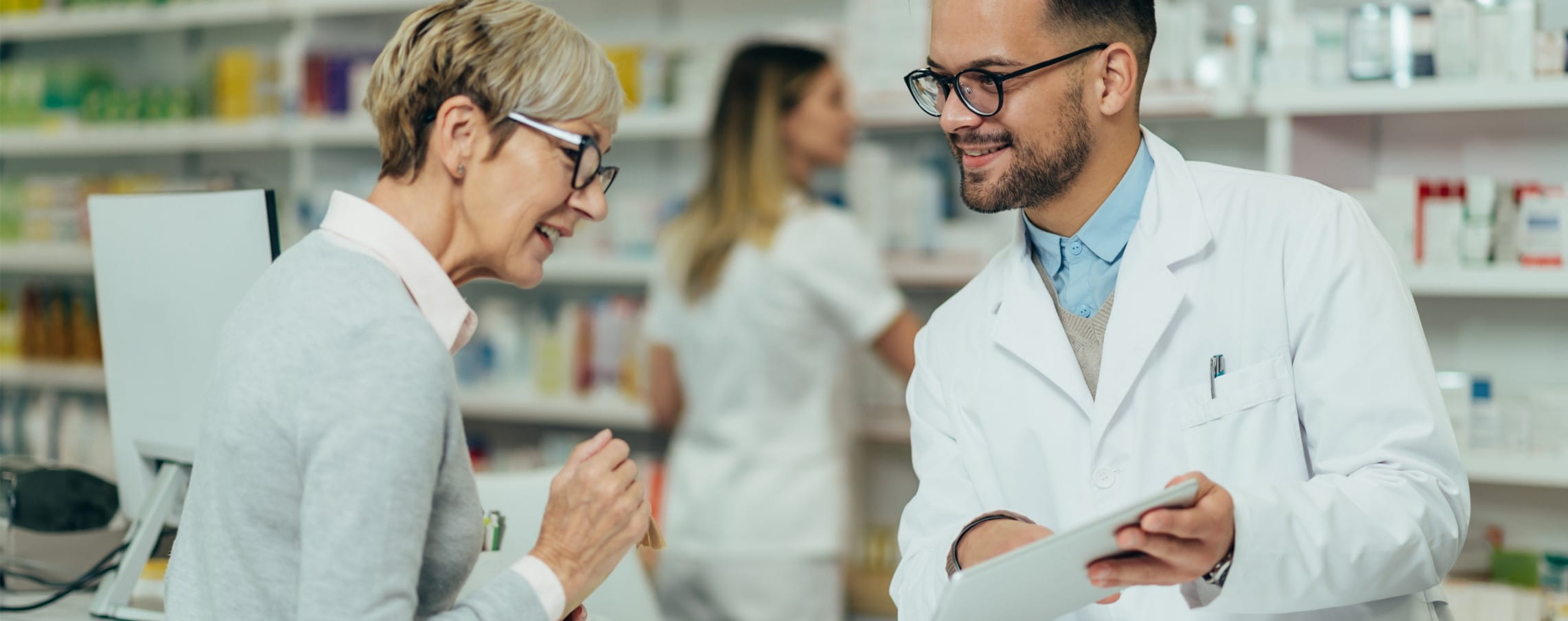 Senior woman visits a pharmacist.